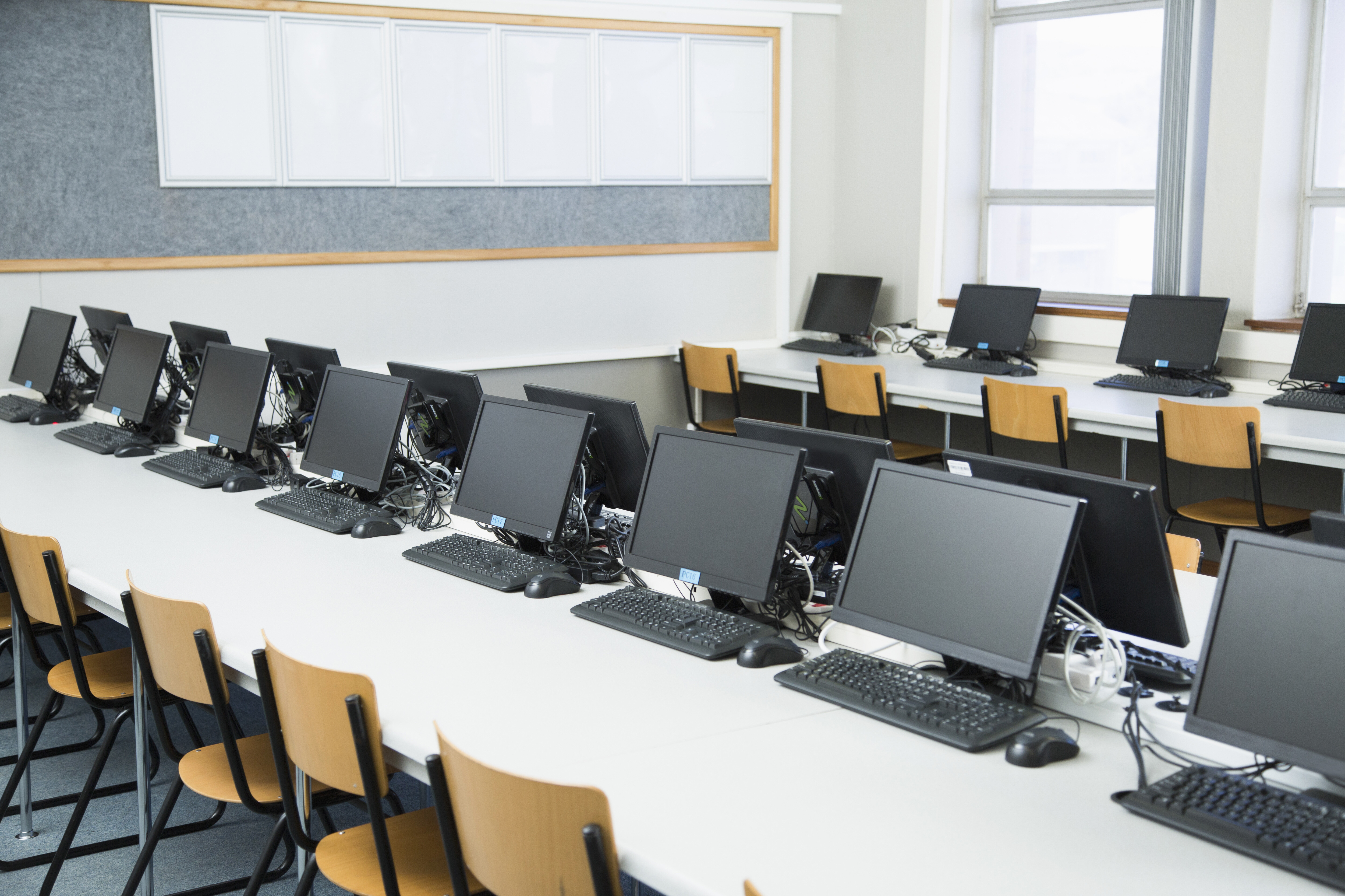 empty-classroom-with-rows-of-personal-computers-on-2025-04-03-02-33-42-utc.jpg